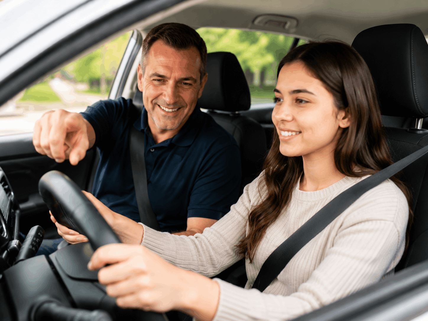 Driving instructor teaching a student behind the wheel